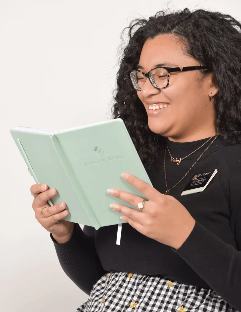 sister missionary holding lds missionary journal